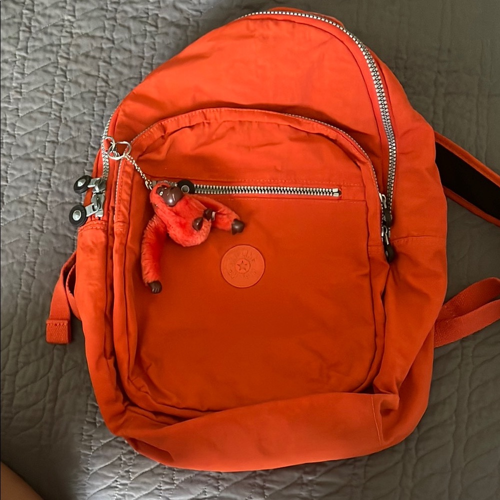 Kipling Bright Orange Backpack with Monkey Keychain